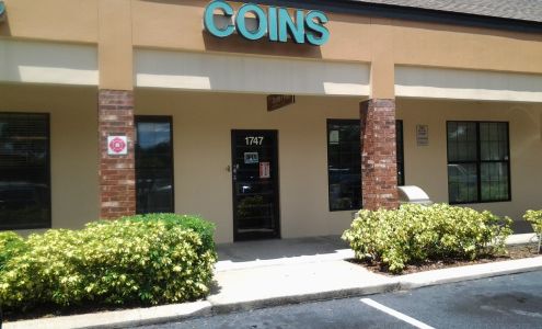 A Village Stamp & Coin