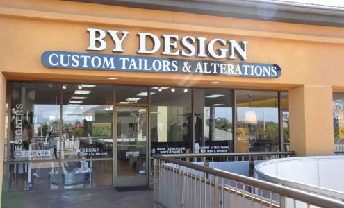 BY DESIGN CUSTOM TAILORS